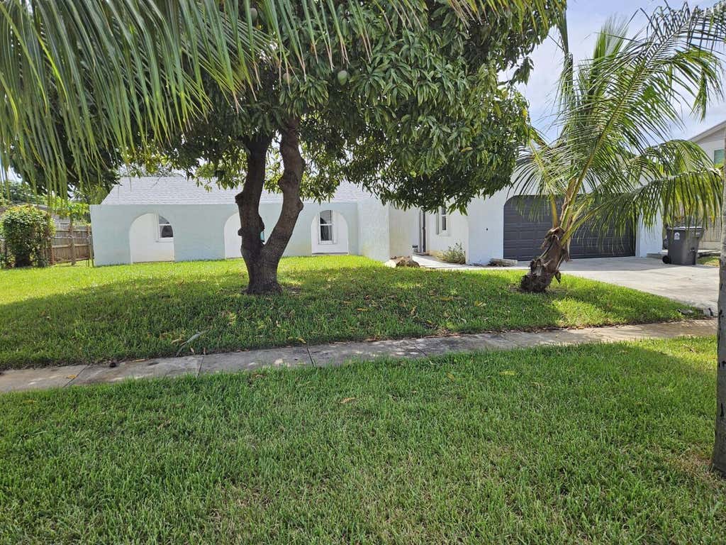 Photo of 1123 Woodbine Road, West Palm Beach, FL 33417 (MLS # R11101495)