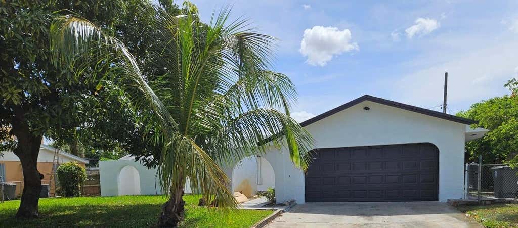 Photo of 1123 Woodbine Road, West Palm Beach, FL 33417 (MLS # R11101495)
