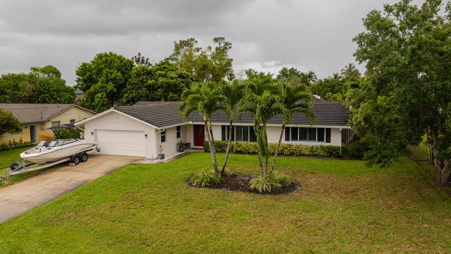 Beautifully renovated pool home on an oversized lot with no HOA, offering flexibility and true Florida lifestyle living. This move-in ready home features a brand new septic system (within the last year, recently serviced with new pumps), a saltwater pool with new timer, and full interior upgrades including new flooring, trim, paint, and removal of popcorn ceilings. The updated kitchen showcases new cabinetry, vain matched Calcutta gold Quartz countertops, designer backsplash, farmhouse sink, and $15k high-end Café appliances. Additional highlights include epoxy garage flooring and a new garage door opener. Spacious, bright, and turnkey with a private backyard retreat perfect for relaxing or entertaining. Custom plantation shutters throughout. Bring your boat and enjoy no HOA restrictions.
