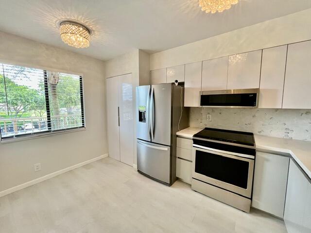 Photo of 6866 HUNTINGTON Lane #306, Delray Beach, FL 33446 (MLS # B26080113)