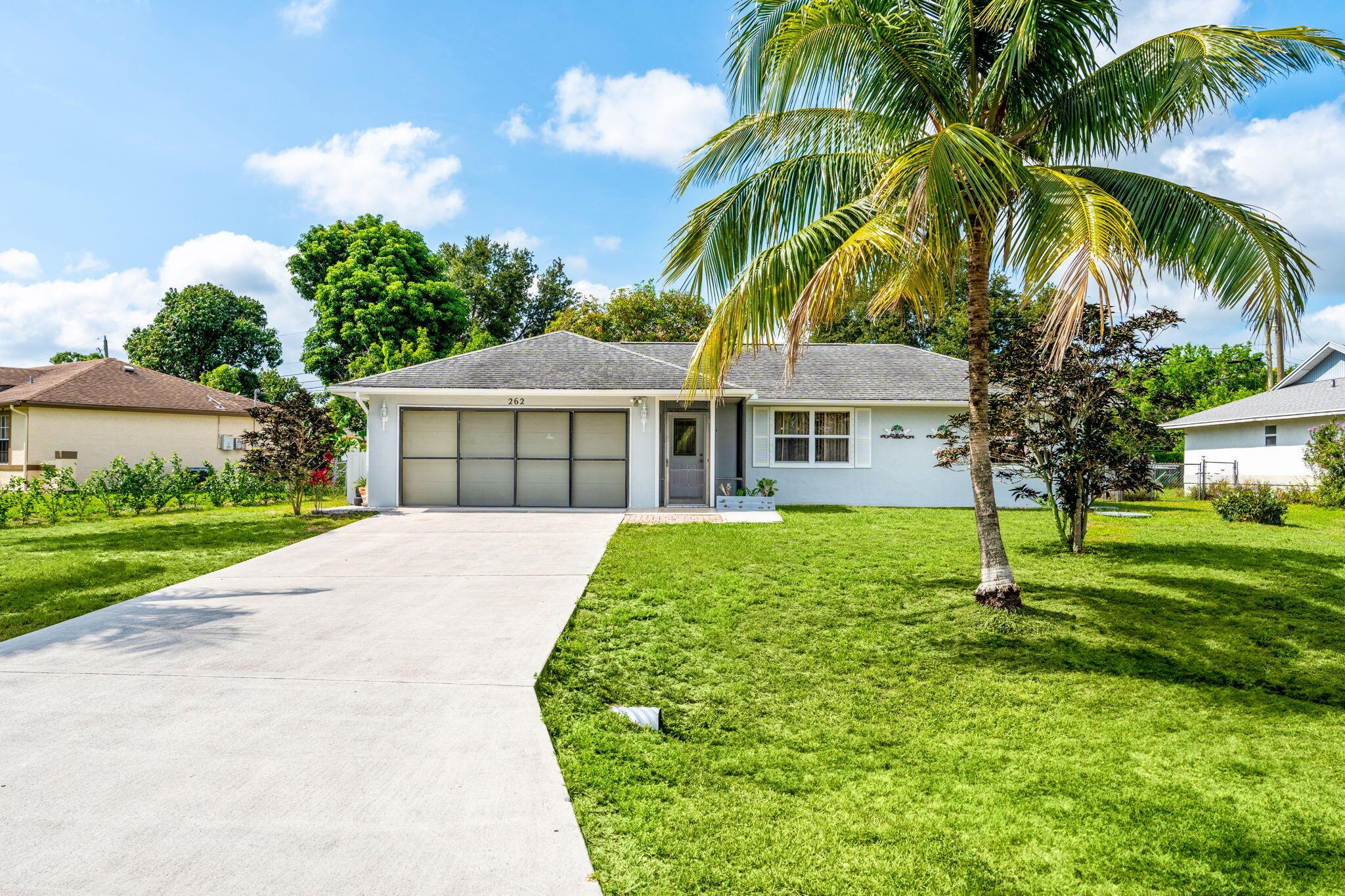 This charming 2 bedroom, 2 bath home with a 2 car garage in a non-HOA community is a perfect blend of comfort and convenience in sunny Port. St Lucie. Whether you're looking for a family home or a peaceful retreat, this property is bound to check all your boxes! Don't miss out on the opportunity to make this lovely house your new home!