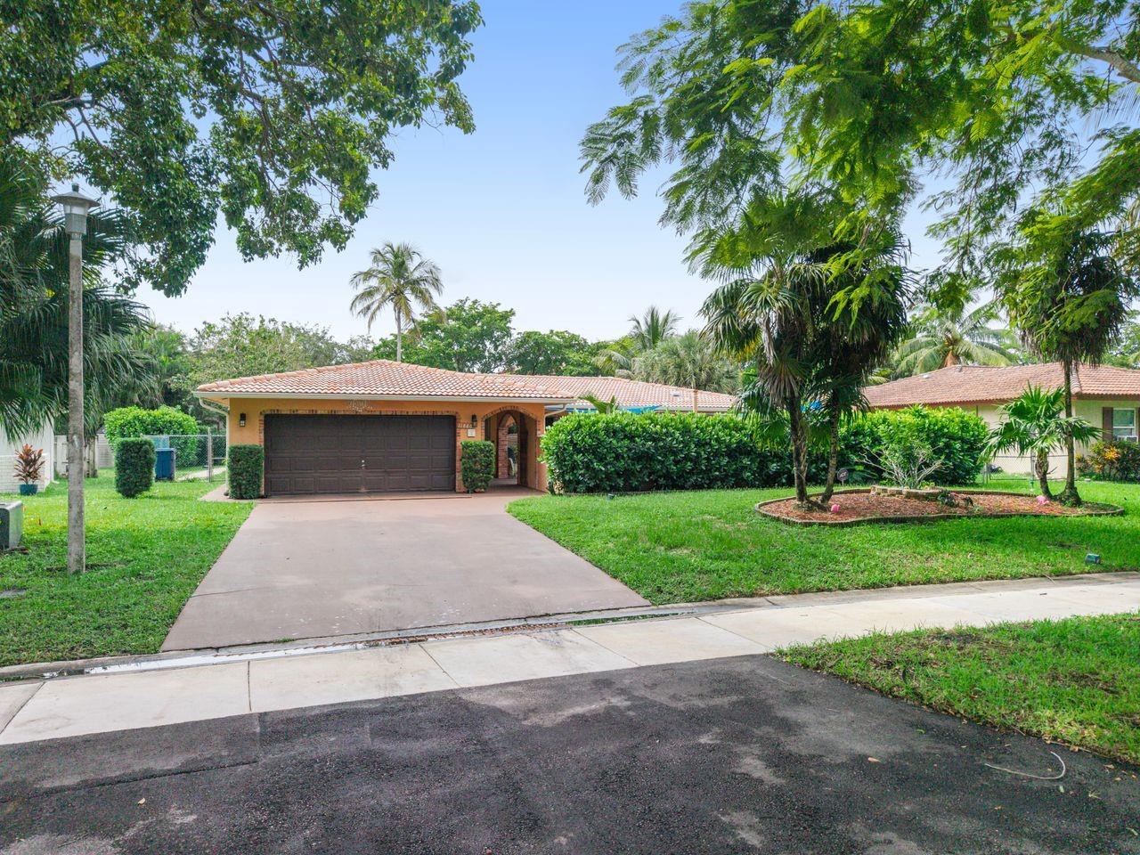 Priced to sell under $700k NO HOA!!Impact windows and newer roof. ONE story home in the highly desirable Westchester community. With a putting green in the front courtyard and a large pool and pizza oven in the back, this home is perfect for entertaining! Featuring a split plan w/ 3 beds, bonus room, 2 baths. Your primary suite has an expanded, spa-like bathroom w/walk-in shower, whirlpool spa tub / walk-in closet. Bonus room being used as a home gym but can easily serve as an office, playroom, additional entertainment space or 4th bedroom. Kitchen has wood cabinets, granite countertops and overlooks your pool. 2 car garage and laundry room. Conveniently located off the Sawgrass Expwy, within 1 mile to A-rated public schools, parks, golf courses, aquatic, tennis and sports complexes!