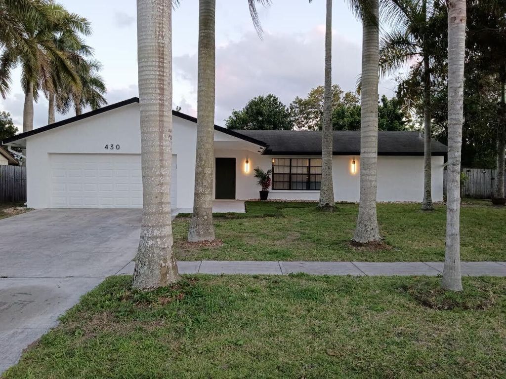 Photo of 430 La Mancha Avenue, Royal Palm Beach, FL 33411 (MLS # B26016538)