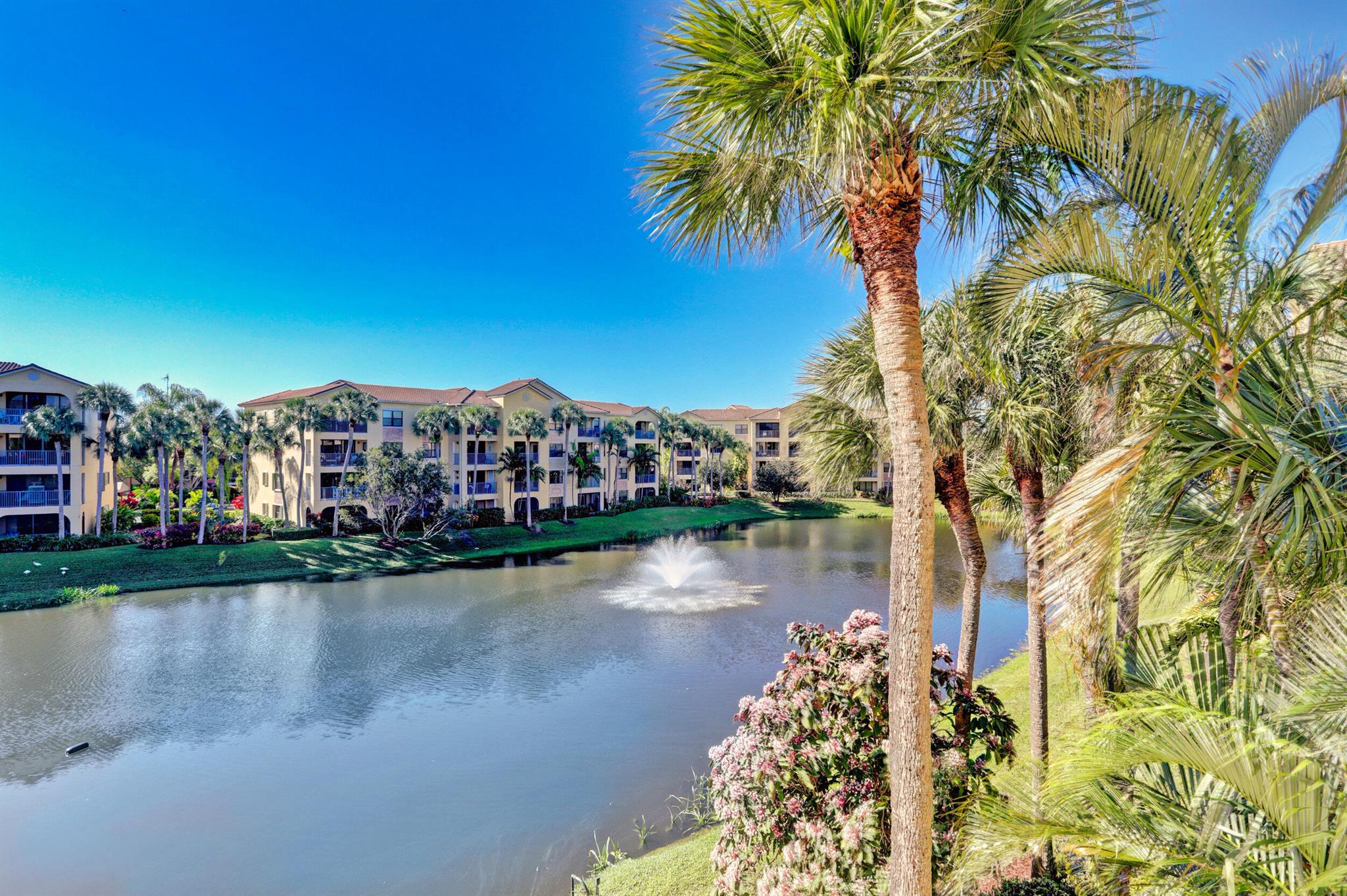 Available August 20, 2025- February 28, 2026 ! This fabulous third-floor condo offers breathtaking lagoon views and southern exposure, filling your private balcony with sunlight all day. The newly remodeled kitchen and fully furnished interior provide a comfortable home-away-from-home. The master bedroom features a queen bed, the second bedroom has a full bed, and the third is set up as an office, perfect for working while on vacation. Located in a gated community with two pools, Jacuzzi tubs, a fitness center and BBQ area. Just minutes from the beach, boating, golf, Downtown Gardens, and top restaurants. Experience Florida living at its finest in this tropical paradise!
