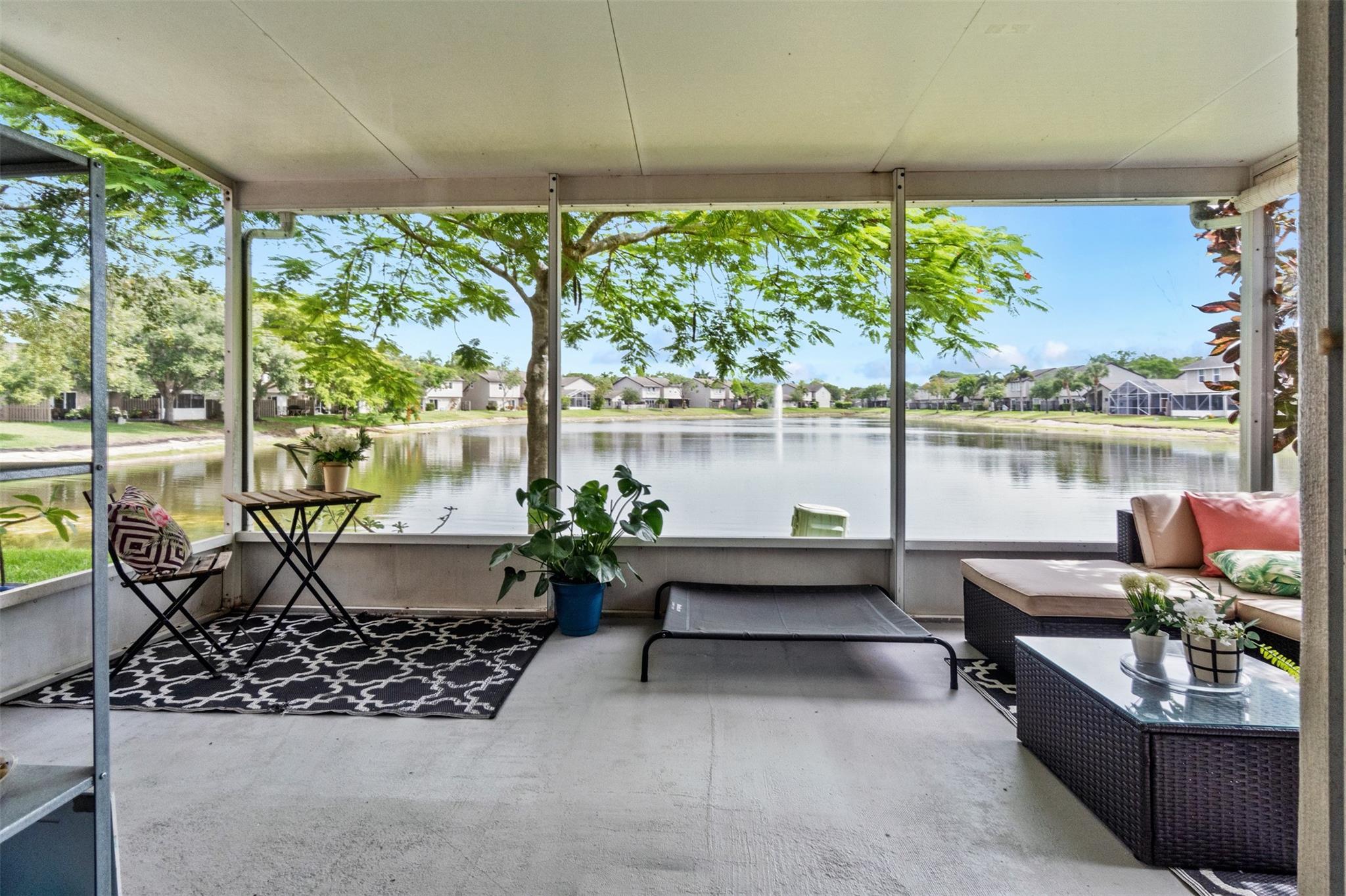Welcome HOME to this beautifully maintained 3/2.5 LAKEFRONT townhouse in the heart of Sunrise. Enjoy tranquil water views from your screened & covered patio. Features Include: Stunning Double Door Entry, Crown Moulding in Living Room with Hi Hats, Neutral Tile Floor Throughout, Newer Microwave & Range (2021), Hot Water Heater (2021), All three bedrooms are located upstairs, offering privacy and quiet. The Primary Bedroom has Large Walk In Closet, Single Vanity & Walk In Shower with Glass Enclosure. Each bedroom features vaulted ceilings, adding to the open & airy feel of the home. Conveniently located near shopping, dining, parks, & major highways, this lakefront gem offers the perfect blend of comfort & convenience. Roof Covered By HOA & Full Hurricane Protection