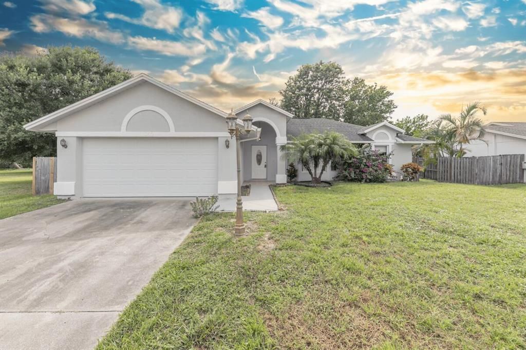 Photo of 1050 SE Euclid Lane, Port Saint Lucie, FL 34983 (MLS # R10740933)