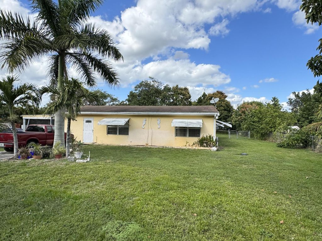 Photo of 4059 Luzon Avenue, Lake Worth, FL 33461 (MLS # R10958616)