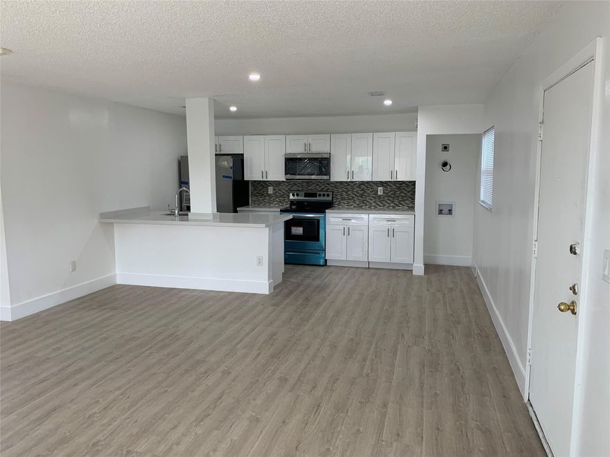 Beautiful large corner unit 2 bedroom 2 bathroom with balcony. Tile flooring throughout, wood cabinets in kitchen, stainless steel appliances, washer/dryer in the unit, and granite counter tops. Water, Garbage and Sewer is included in the rent. Community has pool, bbq area and fenced in open court. Centrally located close to major highways.