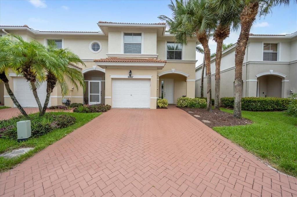 Photo of 6067 Seminole Gardens Circle, Riviera Beach, FL 33418 (MLS # R10731004)