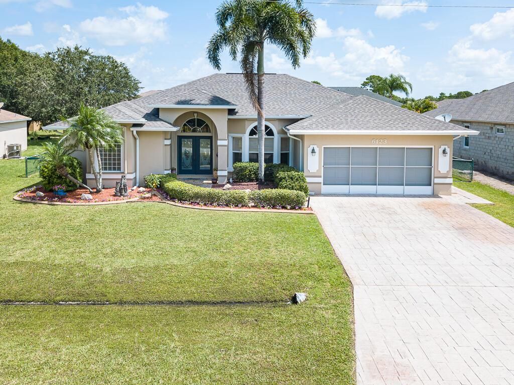 Photo of 6123 NW Drophy Avenue, Port St Lucie, FL 34986 (MLS # R10905004)
