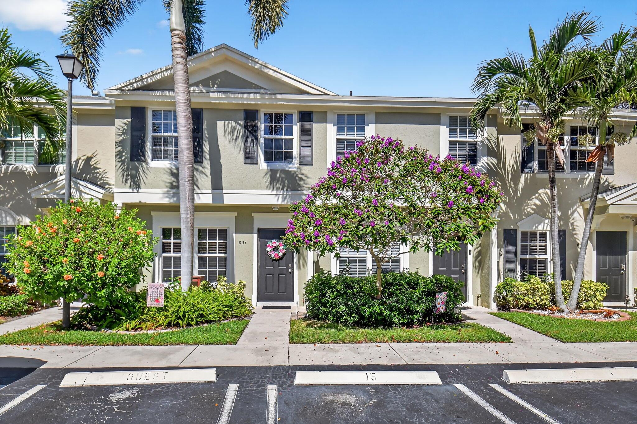 Beautifully Updated 3BD/2.5BA Townhome in Gated Intracoastal Community - Just 1 Mile from Atlantic Ave!Located in the sought-after, pet-friendly Kokomo Key community in charming Delray Beach, this spacious townhome offers the perfect blend of style, comfort, and coastal living.The open-concept first floor features wide plank birch-look ceramic tile, a bright and airy Great Room, and a stunning white kitchen with a large island (seats 4), black Brazilian soapstone countertops, stainless steel appliances, and white wood cabinetry. The spacious lanai boasts 10-ft impact glass sliders and a large storage closet, opening to a private patio perfect for outdoor grilling.Upstairs, you'll find all impact glass windows, title floors,