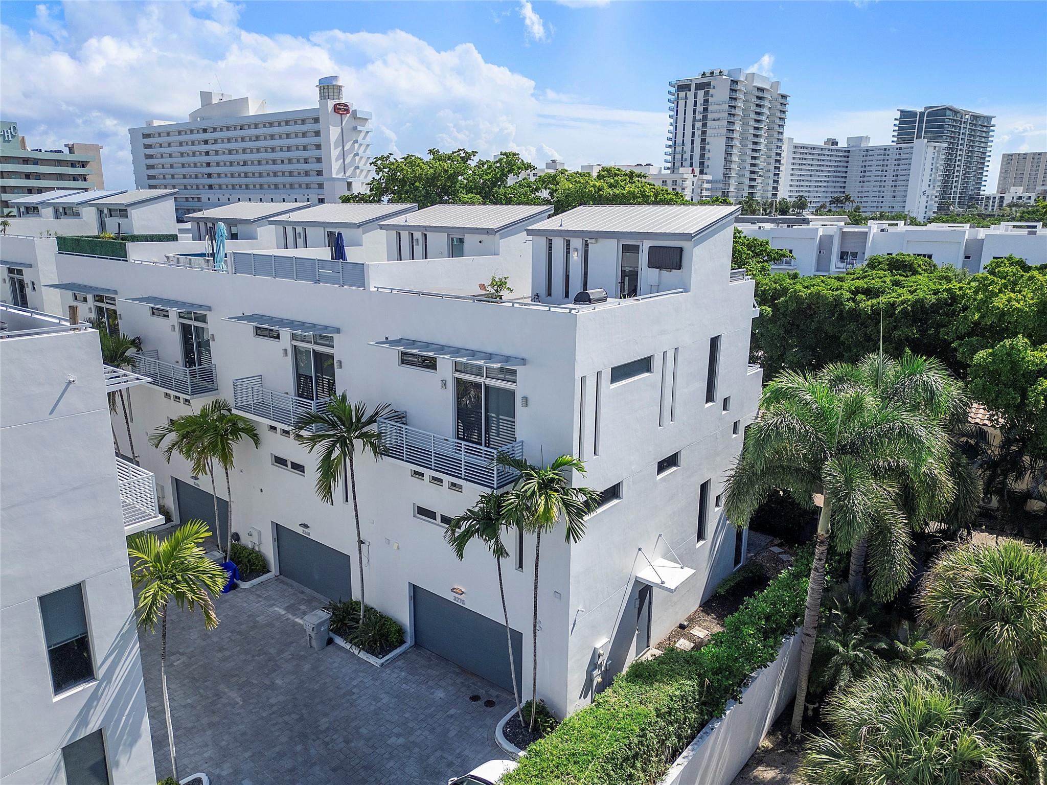 Totally updated 4-story townhome in Palm Cove Lofts featuring 3 bedrooms and 3.5 baths. Walking distance to the beach, water taxi and intracoastal. All impact windows and doors. The first level offers a private bedroom suite and elevator access to all floors. The second floor showcases a spacious living area and chef’s kitchen with 6 gas burners, large center island, abundant cabinets, double wine fridge, laundry room, and half bath. The third floor includes the luxurious primary suite with a walk-in closet, roman tub, and separate shower, plus an additional bedroom suite. Enjoy the rooftop oasis with a summer kitchen and hot tub perfect for entertaining or relaxing under the stars. Total upscale living in this private gated community.