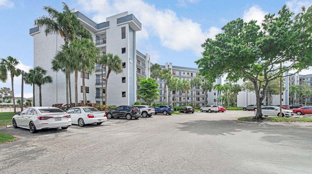 Photo of 4640 W Lucerne Lakes Blvd #206, Lake Worth, FL 33467 (MLS # B26026129)