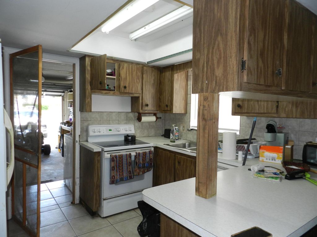 Photo of 3151 Pinehurst Drive, Lake Worth, FL 33467 (MLS # B26018559)