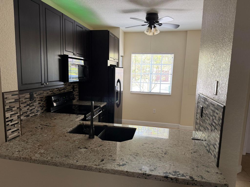 Photo of 8839 S Isles Circle, Tamarac, FL 33321 (MLS # B26025242)
