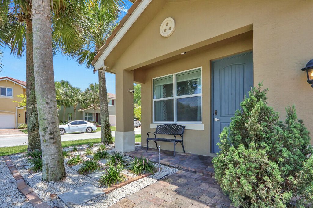 Photo of 4701 Foxtail Palm Court, Greenacres, FL 33463 (MLS # B26044344)