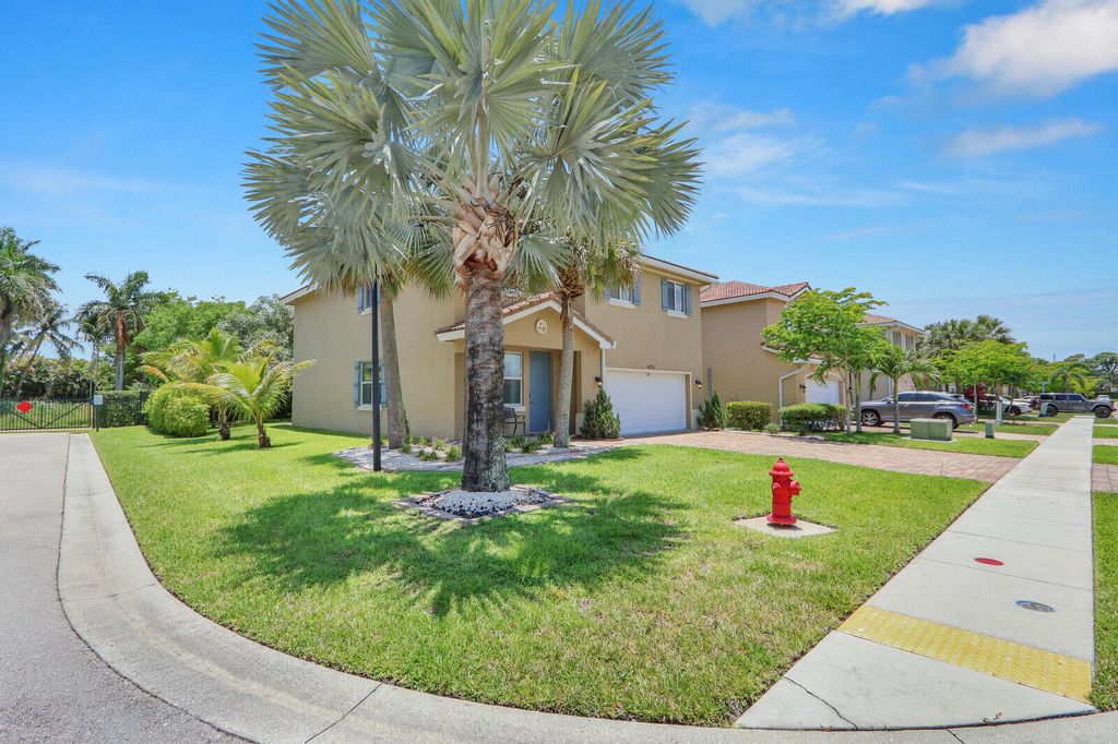 Photo of 4701 Foxtail Palm Court, Greenacres, FL 33463 (MLS # B26044344)