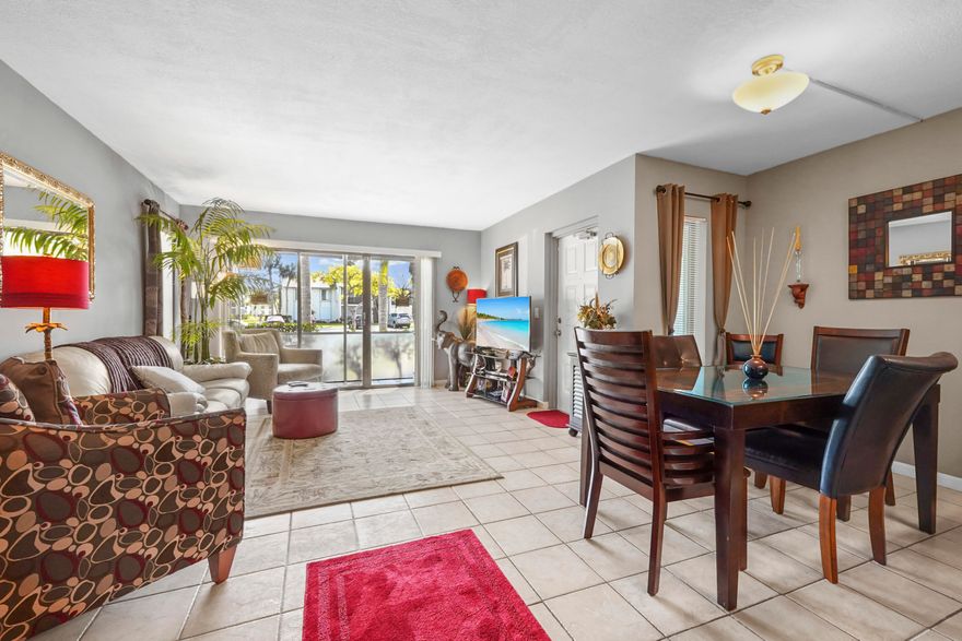 Welcome to The Palm Club Village, a beautifully maintained community offering comfort, convenience, and resort-style amenities. This 2-story condo building features a desirable 1st-floor unit with 2 bedrooms and 2 bathrooms, perfect for easy living.  Step inside to an inviting eat-in kitchen equipped with stainless steel appliances, ample cabinets for storage, and a countertop with bar seating ideal for casual dining. The home features light knockdown ceilings and a comfortable layout that flows into the screened patio, providing a relaxing outdoor space.   Enjoy peace of mind with a manned gate and 24/7 security, along with access to a community pool and clubhouse. Cable is included, adding extra value to this wonderful condo in a prime location.