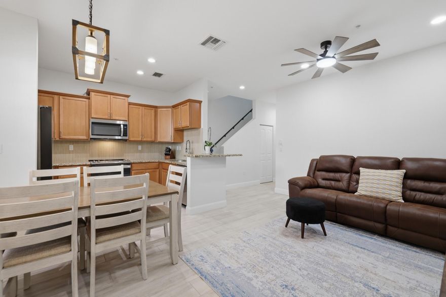 Stunning updated 3 Bed/2.5 Bath townhouse in Pompano Beach featuring brand-new tile floors throughout both levels, impact windows & doors, and 1-car garage. The modern kitchen boasts granite countertops, stylish backsplash, and all-new stainless steel appliances. Open living and dining areas are freshly painted with new lighting and fixtures throughout.The oversized primary suite features a fully remodeled ensuite bath with dual-sink vanity, frameless glass shower, and marble-look tile with matte black fixtures. Custom built-in closet system in the walk-in closet. Two additional bedrooms, and convenient upstairs laundry complete the upper level. Community amenities include pool, fitness center, clubhouse & walking paths around the lake. Minutes to dining, shopping, parks & the beach.       Low HOA fee includes roof repairs, exterior maintenance, landscaping, security patrol, reserve funding, cable & internet and ADT security alarm — making ownership truly hassle-free! Community allows leasing from day one with up to 2 leases per year, making this an excellent investment opportunity as well!