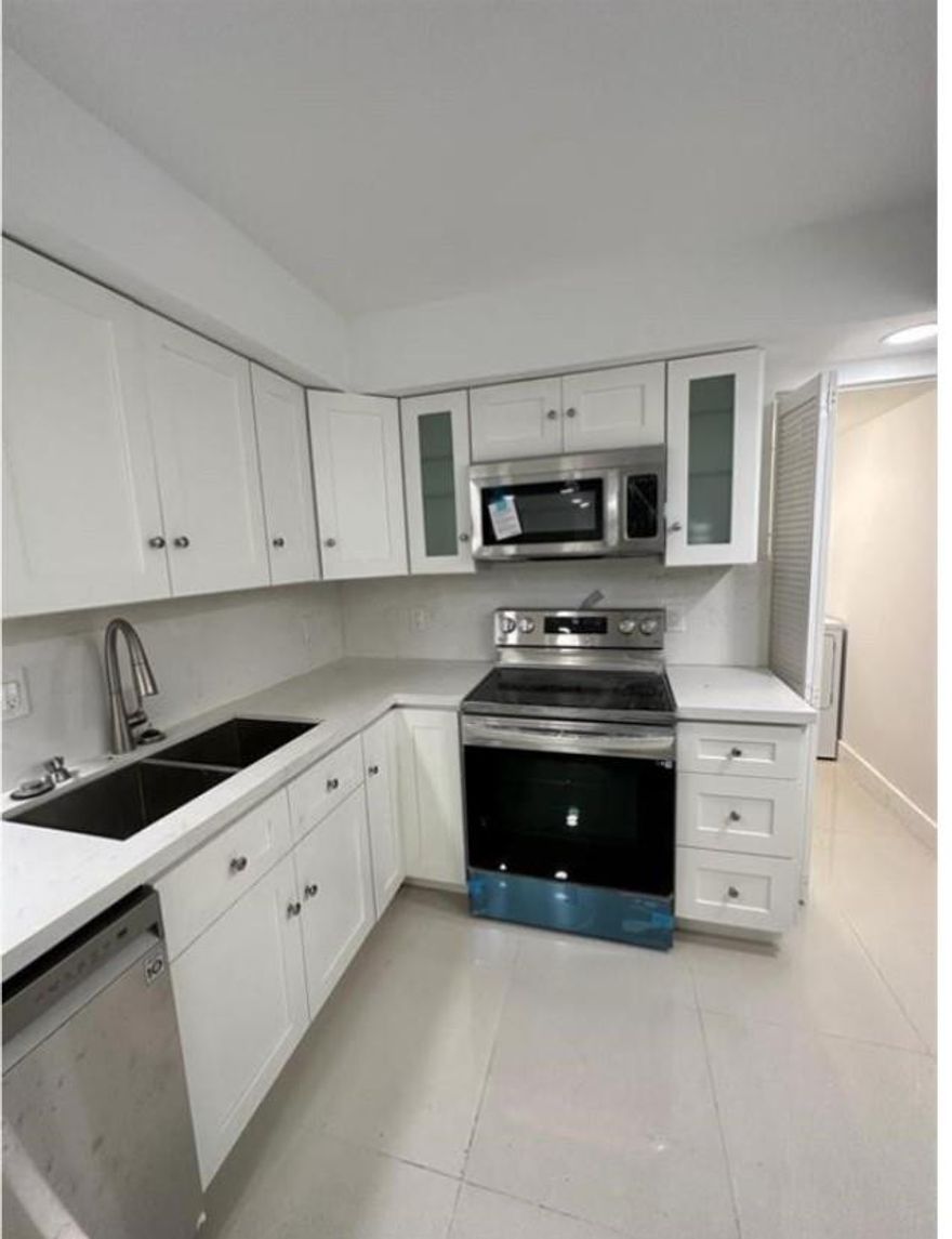 Totally redone with permits new kitchen bathrooms and flooring. Solid wood kitchen quarts countertops porcelain flooring throughout entire apartment. New jacuzzi and new oversized shower in master bathroom.