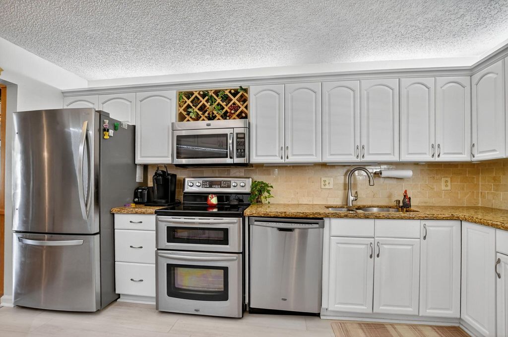 Photo of 5650 Camino Del Sol #200, Boca Raton, FL 33433 (MLS # R11117254)