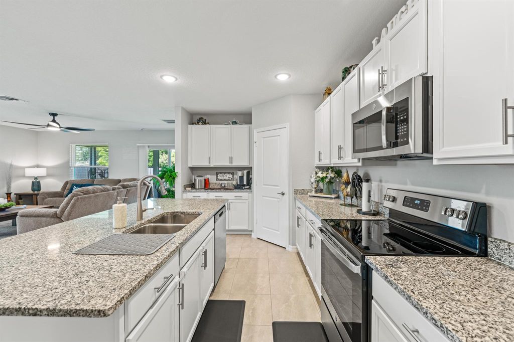 Photo of 545 SW Duval Avenue, Port Saint Lucie, FL 34983 (MLS # R11088635)