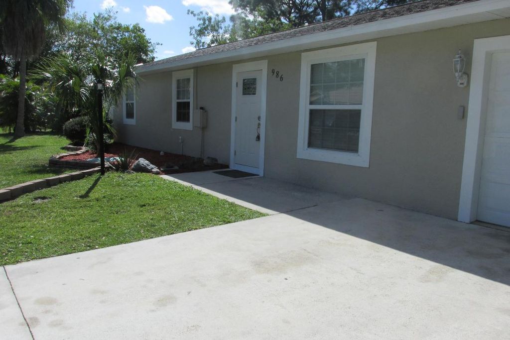 Photo of 986 SE Proctor Lane, Port Saint Lucie, FL 34983 (MLS # R10932352)