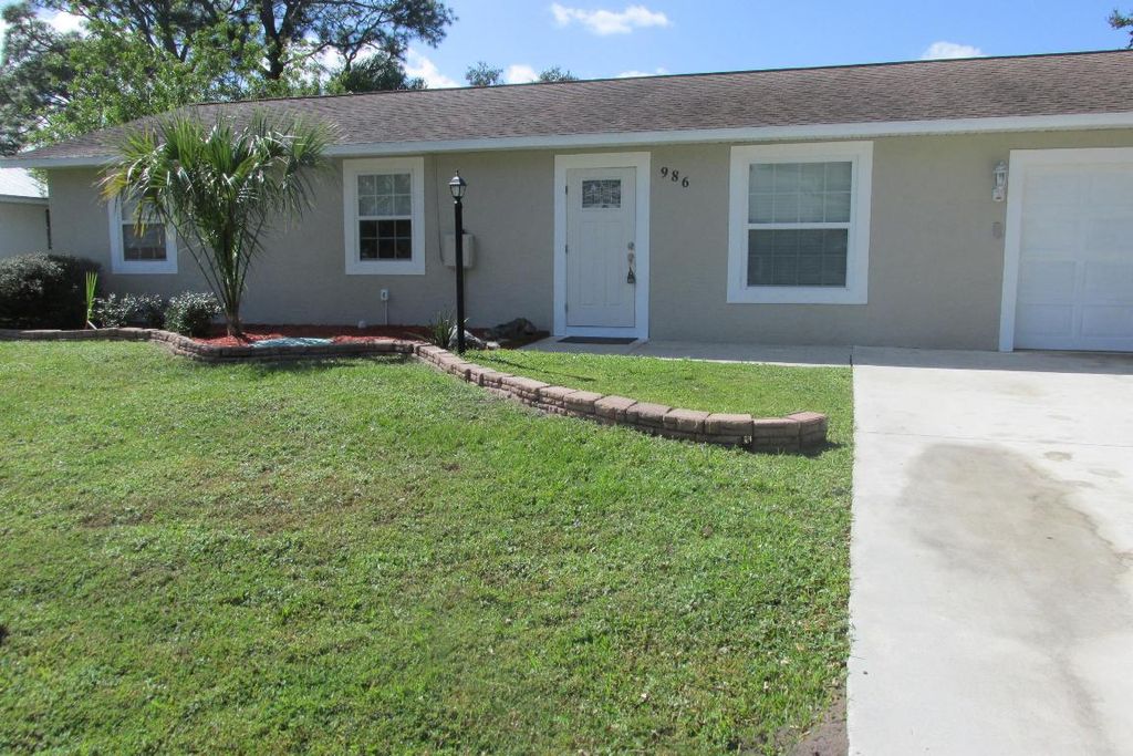 Photo of 986 SE Proctor Lane, Port Saint Lucie, FL 34983 (MLS # R10932352)