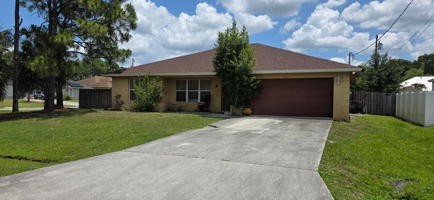 Welcome to this charming corner-lot home located in one of Port Saint Lucie's most convenient and desirable areas. Situated on an oversized lot, this property offers excellent potential for homeowners, first-time buyers, or investors looking to add their personal touch. Features include a functional layout, spacious yard space, and the peace of mind of a newer roof installed in 2024. Conveniently located near Becker Road, I-95, shopping, dining, parks, and schools, this home offers easy access to everything the growing Treasure Coast has to offer. A great opportunity to own in a rapidly developing area of Port Saint Lucie with strong long-term value and no HOA.