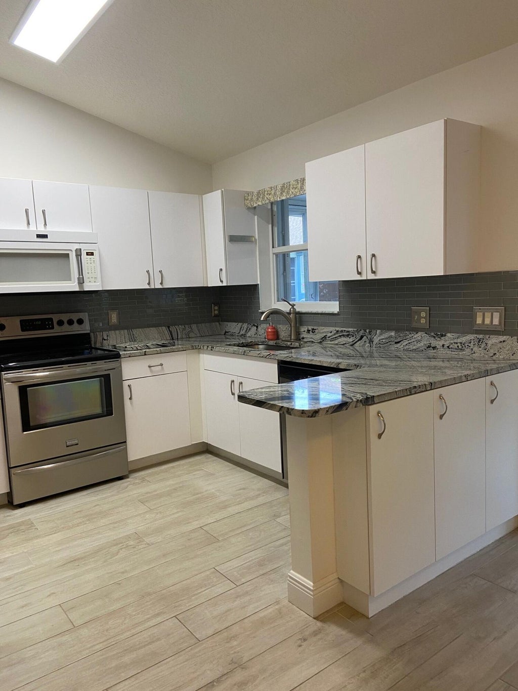 Photo of 311 NW Tuscany Lane, Port Saint Lucie, FL 34986 (MLS # R10996116)