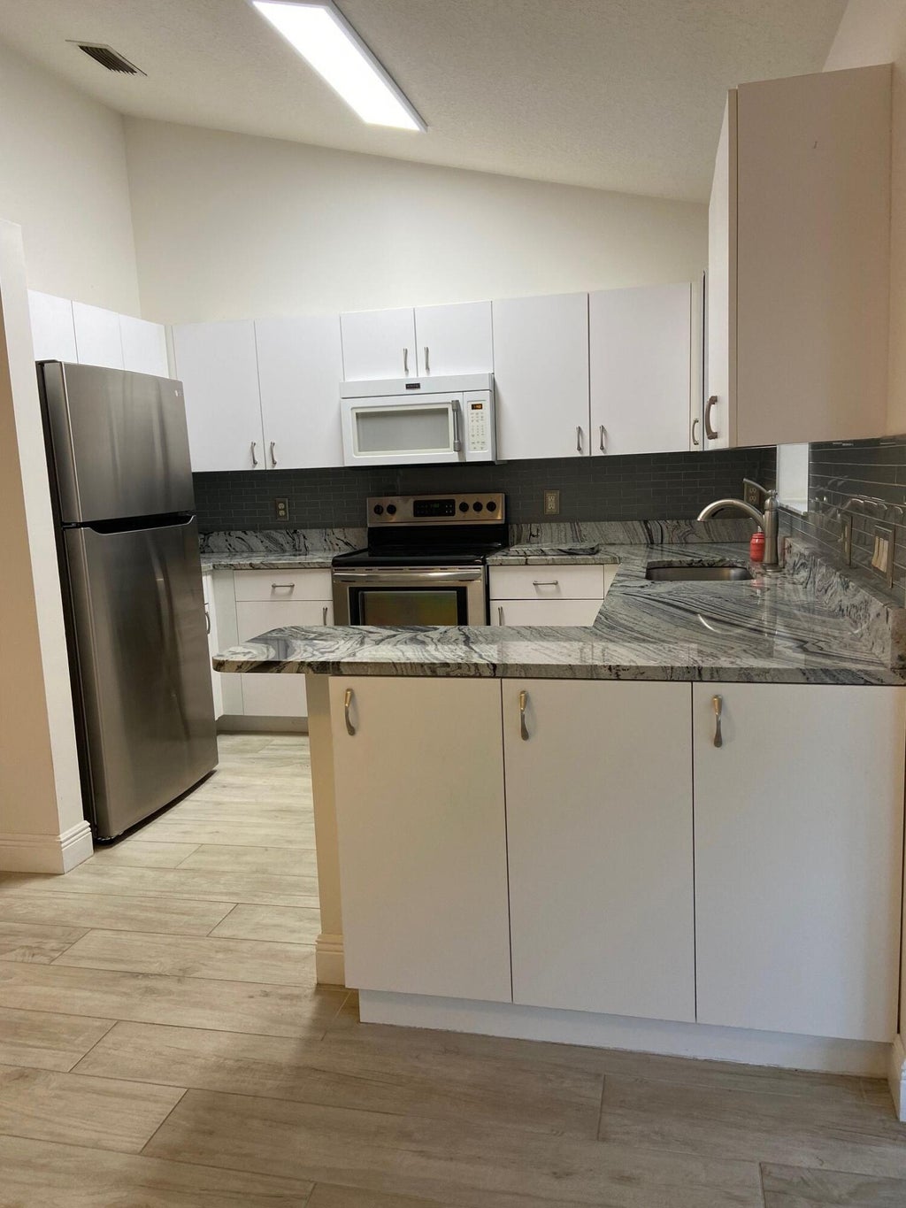 Photo of 311 NW Tuscany Lane, Port Saint Lucie, FL 34986 (MLS # R10996116)