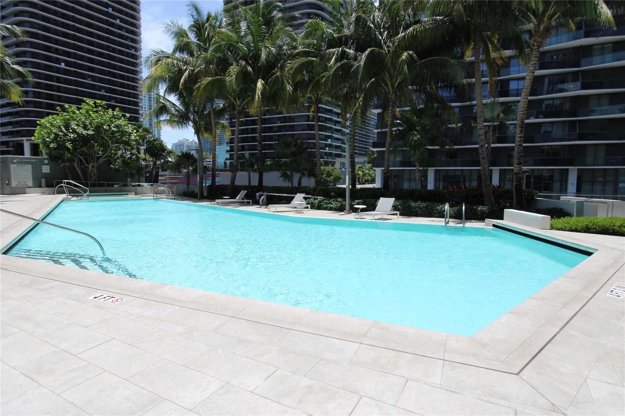 BRICKELL CITY HIGH RISE, VIEWS OF CITY, BAY AND RIVER. WATCH THE SUNSETS TOO. 40TH FLOOR HAS 12 FT CEILINGS. ALL NEW FURNITURE. GRAY QUARTZ STONE COUNTERTOPS W/ TOP OF THE LINE BOCH APPLIANCES. ALSO, A WINE FRIDGE & W/D. WHITE LACQUER ITALIAN CABINETRY & HIMALAYA GRAY MARBLE FLOORING THROUGHOUT. MOTORIZED WINDOW TREATMENTS. INFINITY EDGE POOL & ASSIGNED GARAGE PARKING SPACE. RENTAL PRICE INCLUDES 5G FIBER INTERNET & CABLE. FULL TIME CONCIERGE, GYM, SPA, PLAYROOM, SCREENING ROOM & ULTR-LUXURY SERVICES. THIS UNIT HAS A LARGER BALCONY. ENJOY BCC'S HIGH FASHION SHOPS & RESTAURANTS. VALET PARKING.