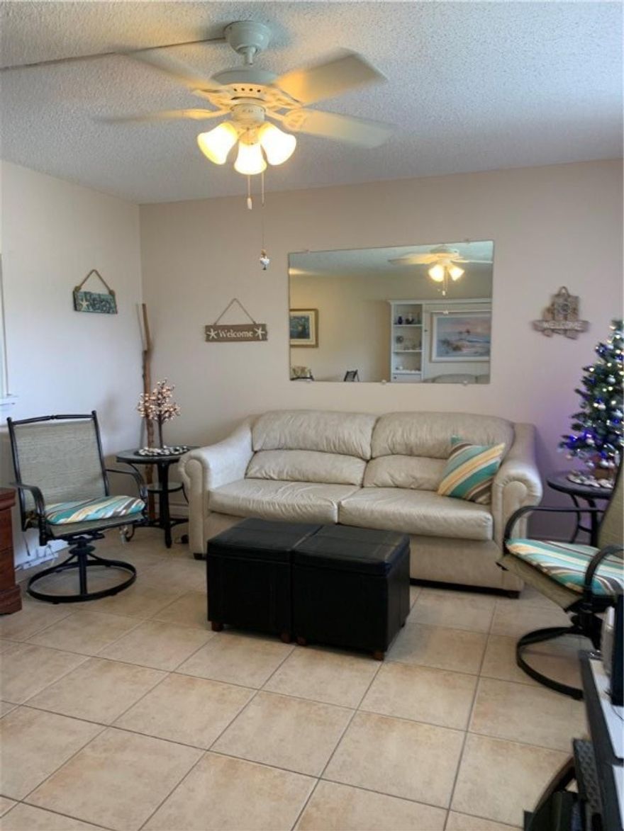 Location, Location, Location, one of the closest units to the Clubhouse and all amenities. Move In Ready! This Lovely 1/1.5 Condo situated on 1st Floor is in one of CVE Most Desirable Areas.Through the Sunroom you'll be able to enjoy a back patio with a wonderful Serene Lake View to sit out in the mornings and enjoy the start of your day with a coffee. Condo has Newer Electrical Panel (2016 ),Newer front wall air conditioner (2016),A New Pride Contract( 2022). Condo is Bright, Cheery and Newly painted through out. Free Bus Service is throughout the Community, A1600 seated Free Movie theatre, 14 Free pool areas to enjoy, Pickle Ball Courts, Craft Rooms, Shuffle Ball & Tennis Courts. With a 24hr Security Patrol.(Rentable after 1 yr ownership).Unit comes furnished.Personal items don't Convey.