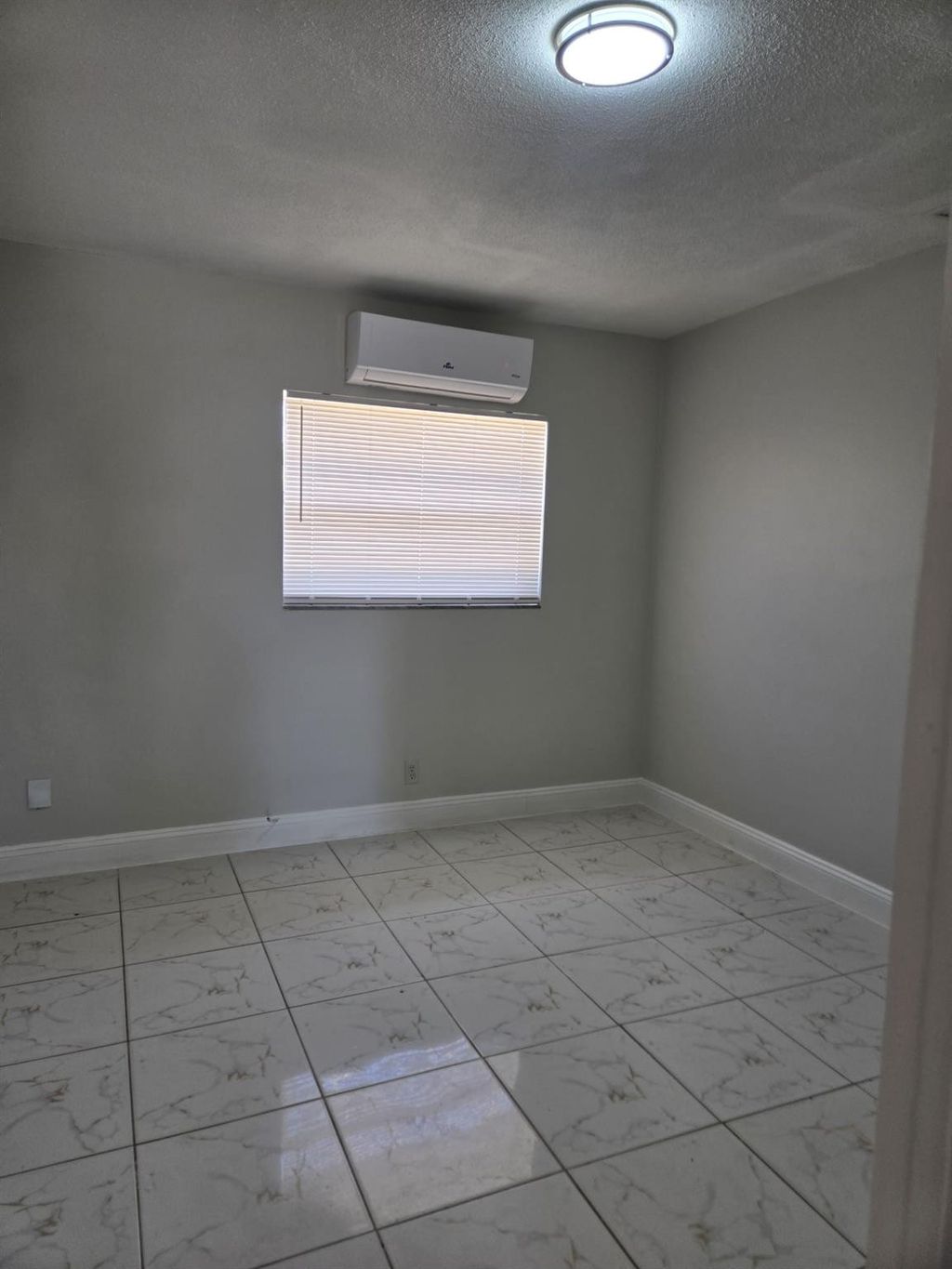 Photo of 581 NE 34th Court #A, Oakland Park, FL 33334 (MLS # B26020269)