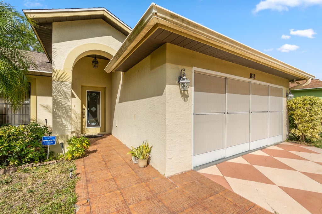 Photo of 1813 SW Grant Avenue, Port Saint Lucie, FL 34953 (MLS # R10779867)