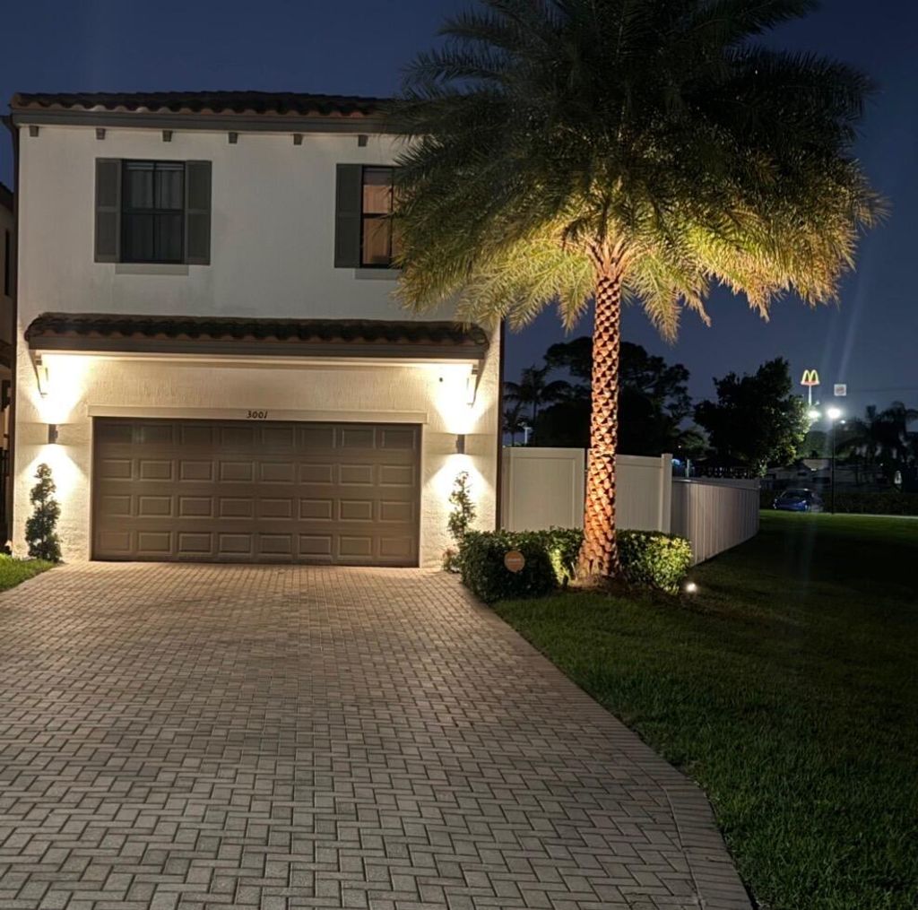 Photo of 3001 King Palm Way, Riviera Beach, FL 33410 (MLS # B26011487)