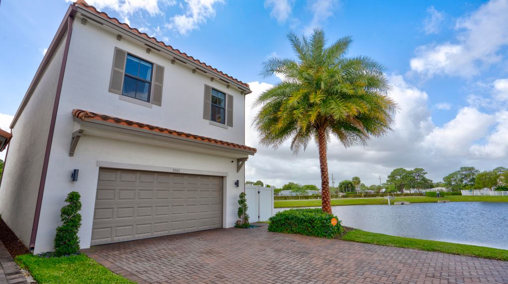 Photo of 3001 King Palm Way, Riviera Beach, FL 33410 (MLS # B26011487)