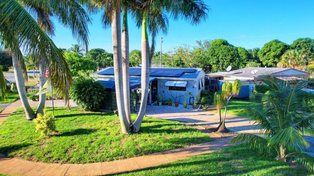 Photo of 407 Tuskegee Drive, Lake Worth, FL 33462 (MLS # R10935782)