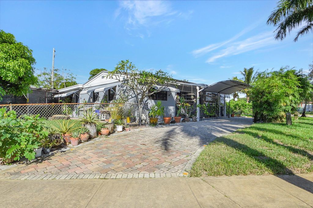 Photo of 407 Tuskegee Drive, Lake Worth, FL 33462 (MLS # R10935782)