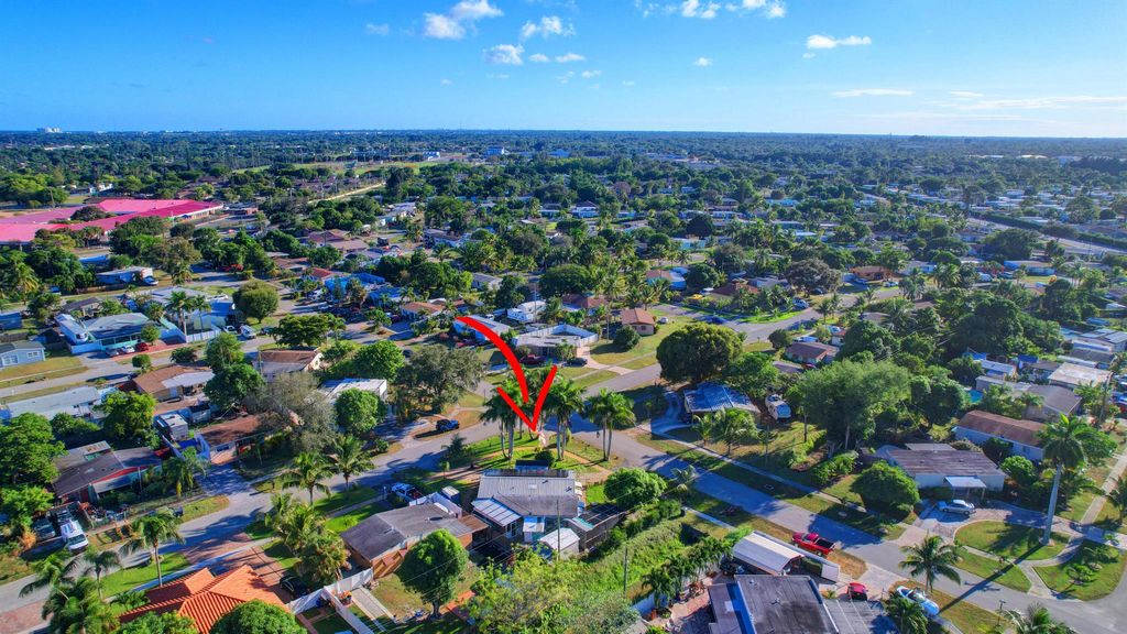 Photo of 407 Tuskegee Drive, Lake Worth, FL 33462 (MLS # R10935782)