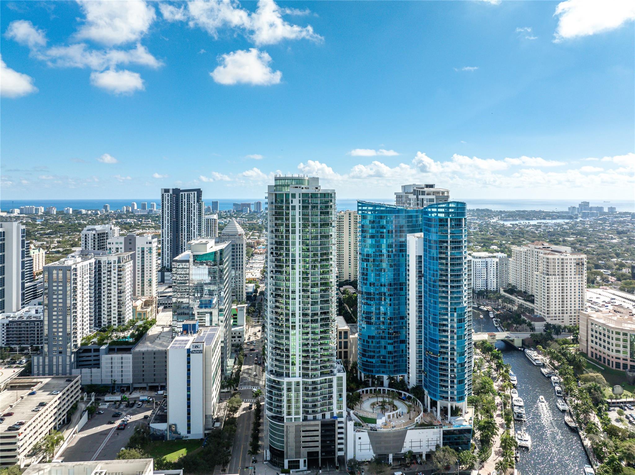 Once-in-a-lifetime chance to own a TRUE TOP-FLOOR PENTHOUSE in the tallest tower in Broward & Palm Beach Counties! Soaring from the 46th floor, PH4 commands unmatched 360° views—sunrise, sunset, ocean, city, even Miami—all from two private terraces. This rare penthouse retreat offers ultimate privacy, found only at this level. Inside: 2 large bedrooms, a flexible den, and 3 full baths. Exclusive 10' floor-to-ceiling windows flood the open living space with natural light. Premium upgrades include 2 EV charging parking spots, induction cooktop, motorized blinds, California Closets & whole-home water filtration. Best of all: top-tier building amenities and the vibrant Las Olas lifestyle just outside your door. PH4 is more than a residence—it’s a statement. Own the sky!