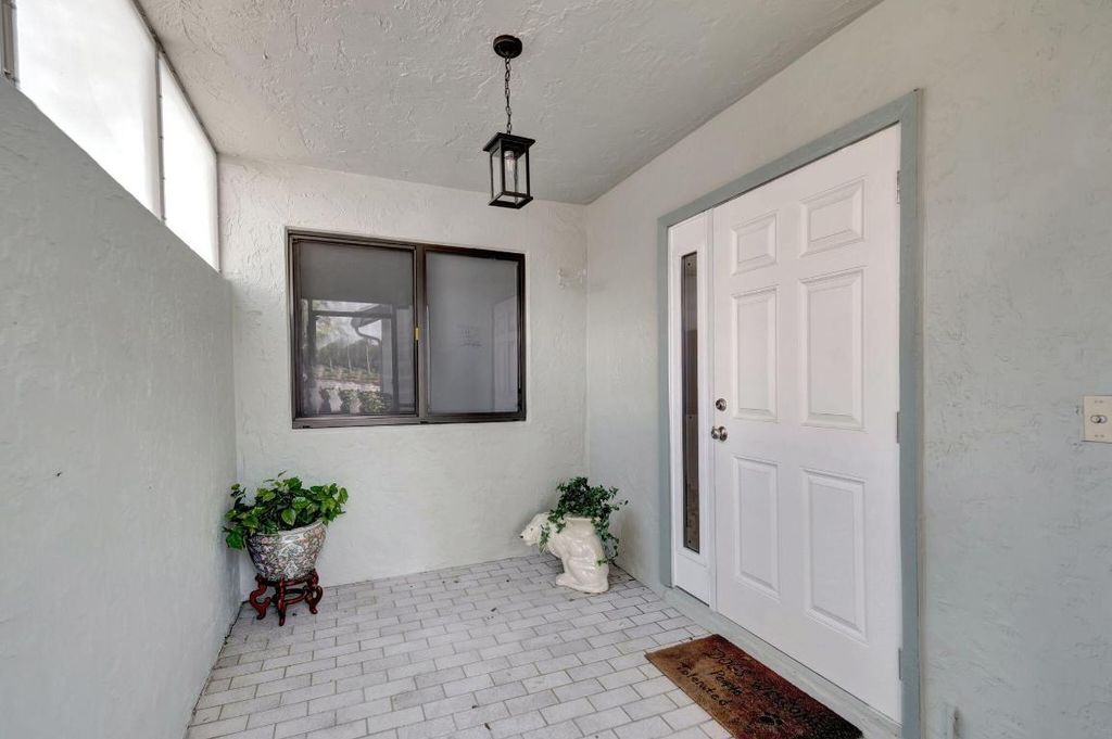 Photo of 1395 NW 23rd Lane, Delray Beach, FL 33445 (MLS # R11125663)
