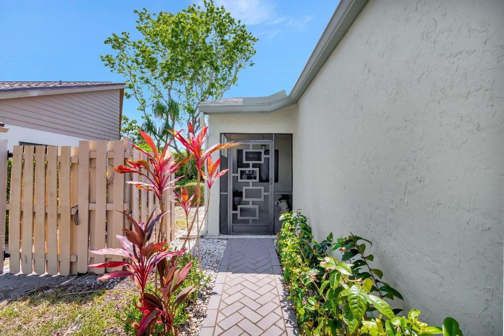 Photo of 1395 NW 23rd Lane, Delray Beach, FL 33445 (MLS # R11125663)