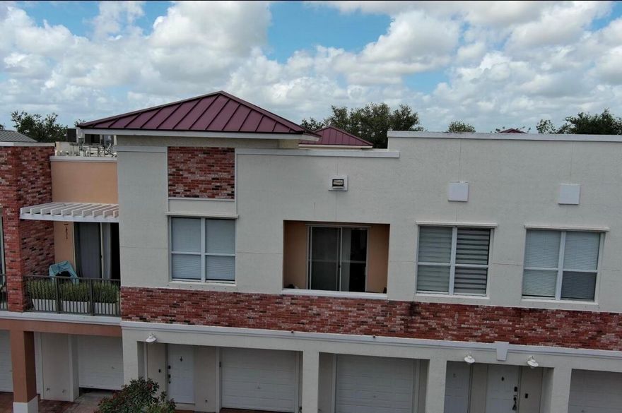 Easy worry-free living in the heart of Tradition. This beautiful, modern, light and bright unit has been meticulously maintained and boasts unique features like exposed brick and gorgeous granite countertops. You'll enjoy plenty of storage with two closets in the primary bedroom, and a primary bathroom with a deep tub and a separate spacious, beautifully tiled shower. Relax or entertain on either of two private balconies, take a short walk to the community pool, and walk or ride a bike to the multitude of shops, restaurants, and festivities in Tradition. This condo also has a one-car attached garage with ample room to park a car, and plenty of room for storage. No back-breaking yardwork or projects here! Come see why this beautiful home should be yours today!