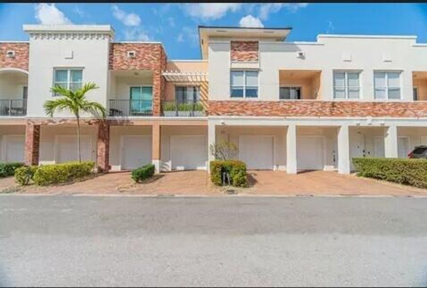 Easy worry-free living in the heart of Tradition. This beautiful, modern, light and bright unit has been meticulously maintained and boasts unique features like exposed brick and gorgeous granite countertops. You'll enjoy plenty of storage with two closets in the primary bedroom, and a primary bathroom with a deep tub and a separate spacious, beautifully tiled shower. Relax or entertain on either of two private balconies, take a short walk to the community pool, and walk or ride a bike to the multitude of shops, restaurants, and festivities in Tradition. This condo also has a one-car attached garage with ample room to park a car, and plenty of room for storage. No back-breaking yardwork or projects here! Come see why this beautiful home should be yours today!