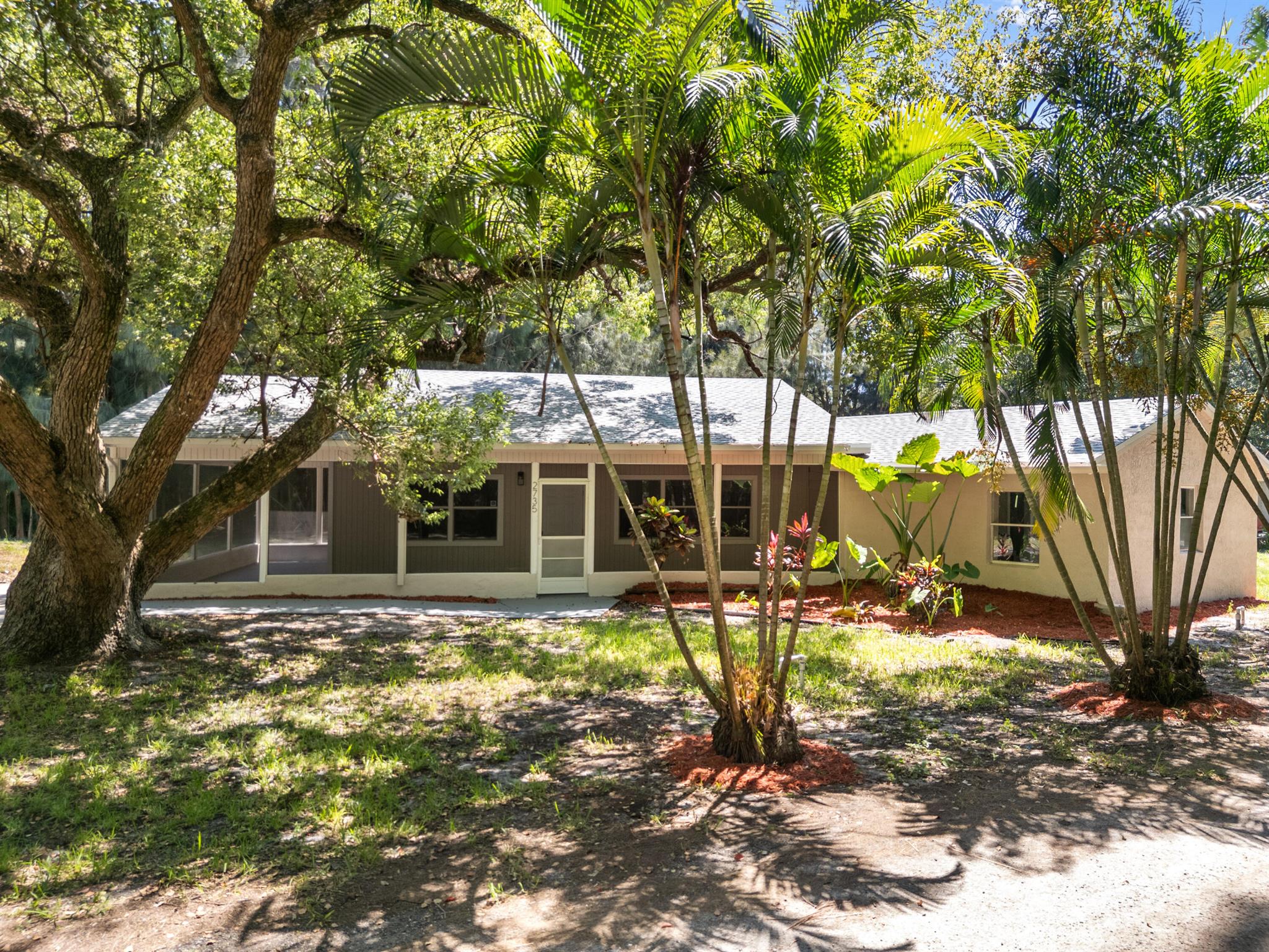 This is the home you've been searching for! Completely renovated in 2025! Situated on a quiet street in a quiet neighborhood, this modern contemporary three bedroom, two bathroom home boasts a brand new gourmet kitchen with quartz countertops, beautiful cabinetry, and stainless steel appliances. Both bathrooms have been beautifully remodeled. Luxury vinyl plank floors throughout. Roof 2025. Outside the large lot has mature Oaks and Pines along with a new concrete driveway and plenty of room for a pool. This Home is just like new. Centrally located near beautiful beaches, shopping, restaurants, great schools and much more. No HOA restrictions, bring your boats, RVs, & motorcycles. Don't let this one slip away!