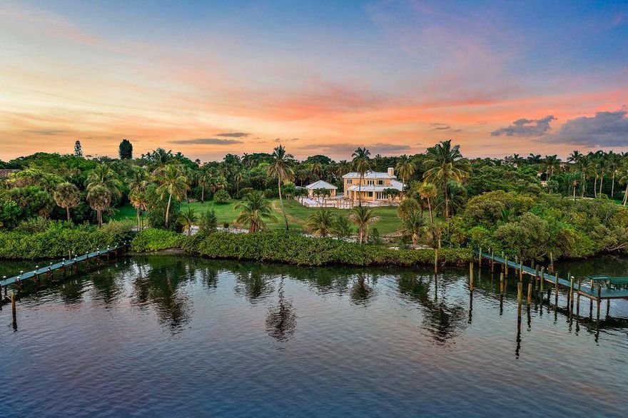 The possibilities are endless with this Jupiter Island home sitting on 1.5 acres of land and approximately 146 feet of deep-water Intracoastal frontage with an expansive dock and extraordinary deep blue water views.  The residence currently features 4 Bedrooms, 6 Baths, a 2 Story foyer, and optional spaces to enjoy the ocean breezes. Situated in the premier location of Jupiter Island; this property encompasses the perfect combination of proximity to shops and restaurants, yet secluded enough for serenity and privacy.