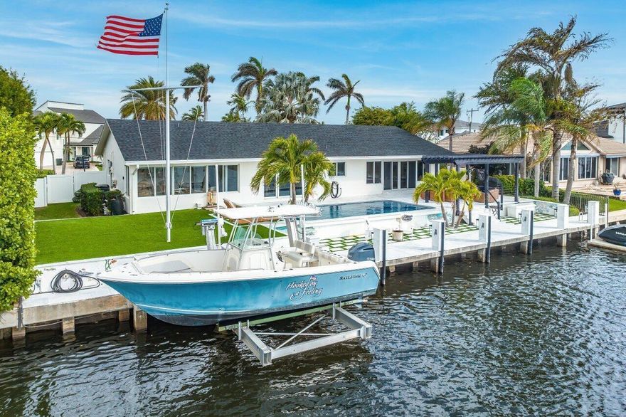 Available July 4, 2026. Turnkey furnished rental on 100 feet of waterfront at one of South Florida's best-kept secrets, Inlet Cay of Ocean Ridge. This property offers waterfront living in a perfectly renovated, designer furnished home. Very tranquil, private backyard with peaceful waterfront boasting commanding unobstructed views of natural mangrove islands. Open floor plan with expansive impact sliding glass doors to maximize the waterfront views. Enjoy the indoor/outdoor living with a pergola, grill, outdoor TV, infinity pool with a sun shelf and spa with waterfall feature surrounded by an expansive patio and yard. Hard wood flooring and tile throughout. Stroll to the beach. Boat to the Boynton Beach inlet and ocean. Just minutes to the attractions of Delray Beach and Palm Beach. Available for monthly rental beginning July 4, 2026.