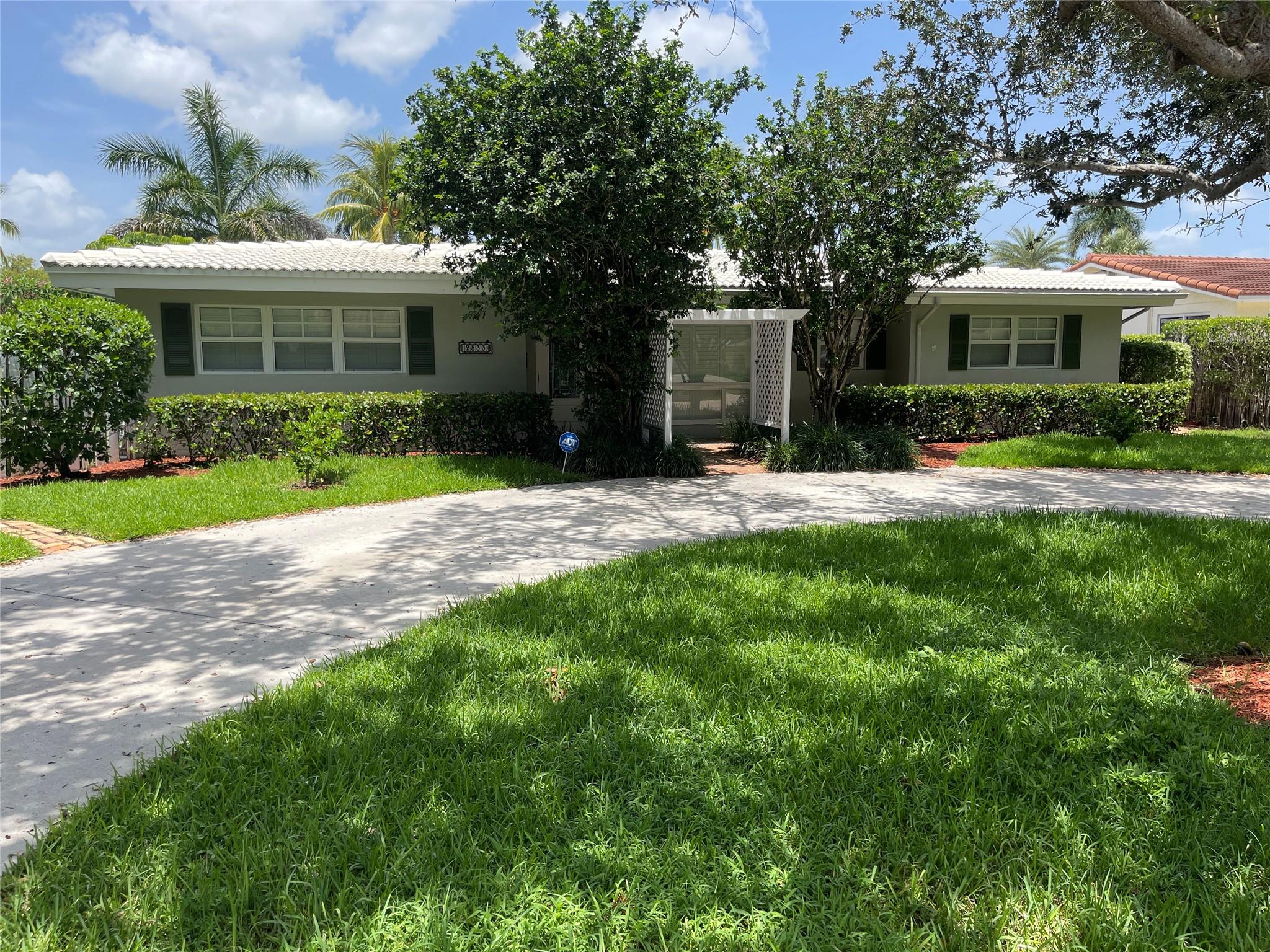 wOw! See this stunning 3 bedroom, 2 bath home with a large family room, custom kitchen, huge backyard, and private pool. Home features a split floor plan, and boasts a gorgeous custom kitchen with a gas stove, newer high end refrigerator, tons of cabinet space and counters. Impact windows and doors throughout which let in a lot of light, and views of the beautiful, large backyard. Garage was converted to a laundry room, an office, and a big air conditioned storage area that is accessible from the outside only. Great location minutes to the intracoastal, shops, and restaurants. Don't miss this one!!