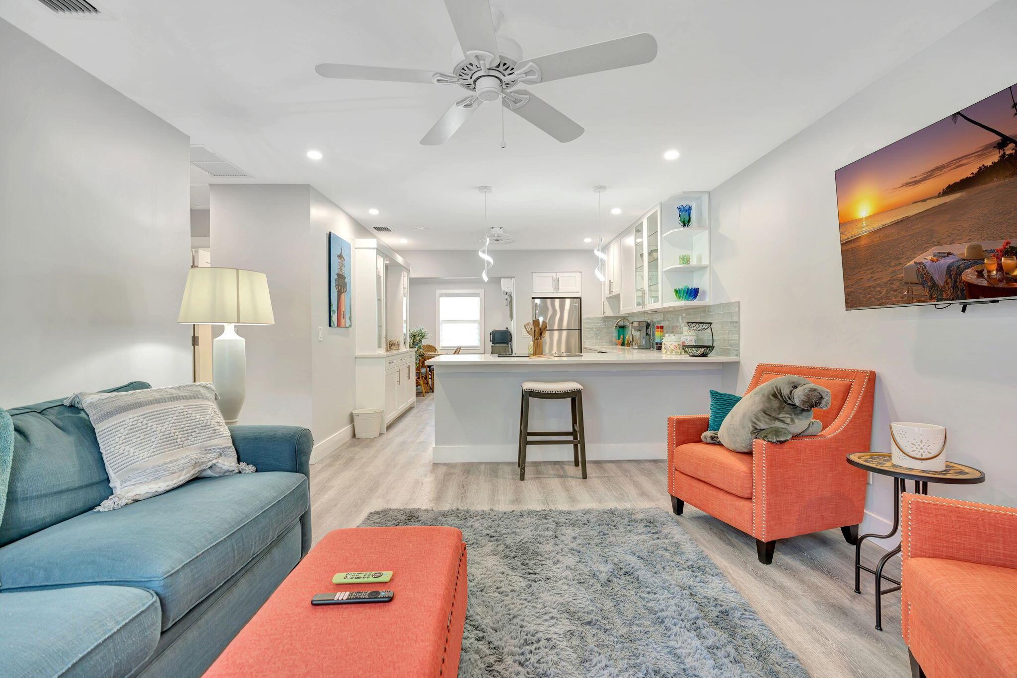 Beautifully updated and fully furnished 2 bedroom, 2 bathroom rental located in the heart of Jupiter, just 2 miles from the beach. This light and bright unit features an open-concept layout with coastal-inspired decor, luxury vinyl plank flooring, and a modern kitchen equipped with stainless steel appliances, quartz countertops, and counter seating.The spacious primary suite includes a king bed and en-suite bath, while the guest bedroom offers a comfortable queen bed with adjacent full bath. Enjoy stylish furnishings, smart TVs, high-speed Wi-Fi, in-unit laundry, and assigned parking.